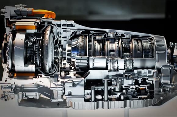 Technician inspecting transmission components